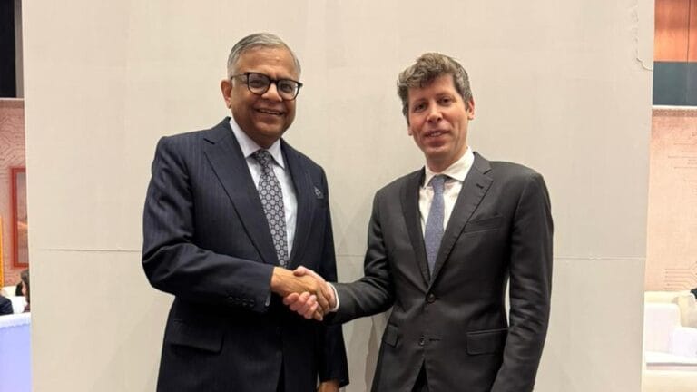 Tata CEO Natarajan Chandrasekaran shaking hands with OpenAI CEO Sam Altman