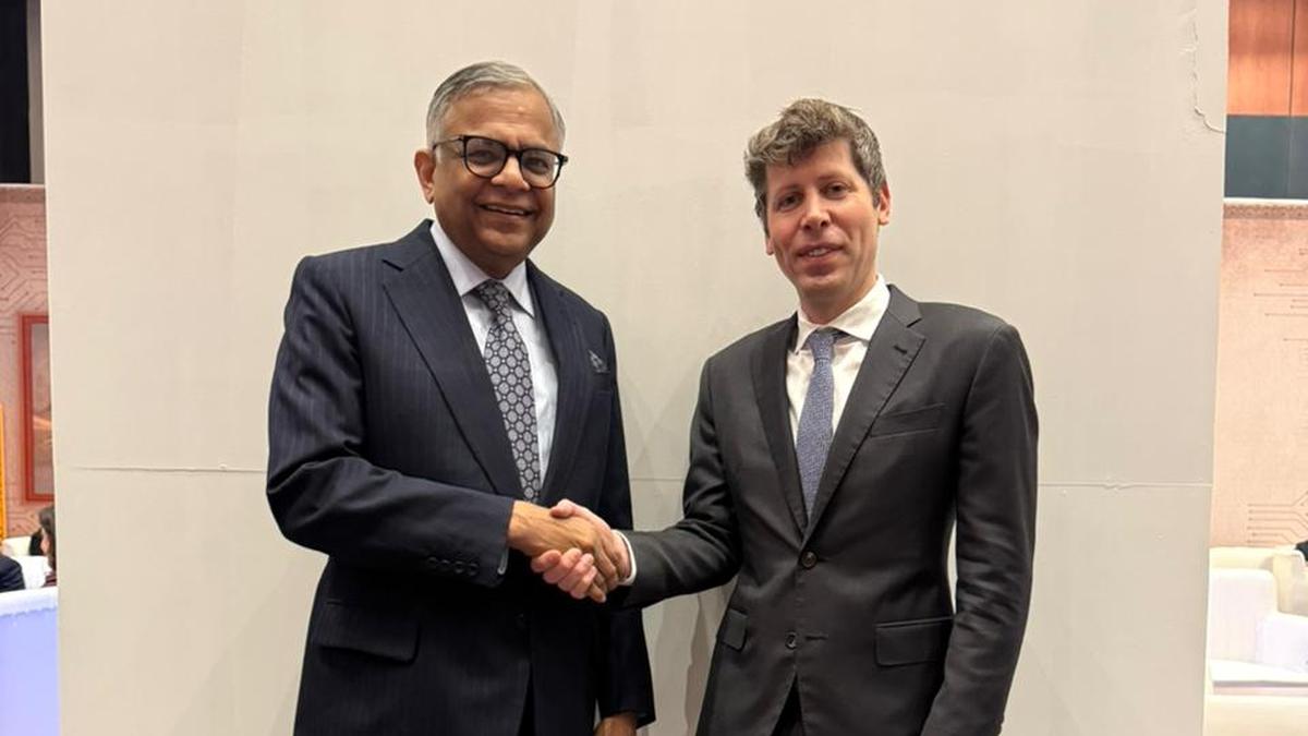 Tata CEO Natarajan Chandrasekaran shaking hands with OpenAI CEO Sam Altman