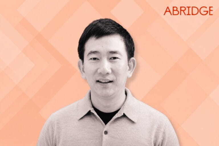 Portrait of Abridge CTO San Oo against a peach geometric background with the Abridge logo in the top right corner.