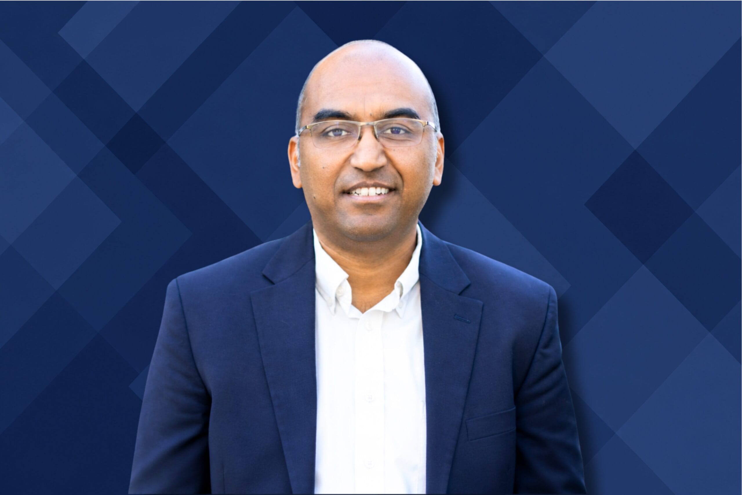 Dr. Arun Subramaniyan, founder, articul8, portrait with geometric deep blue background