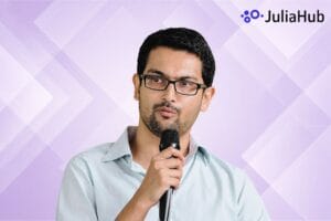 JuliaHub CEO and Logo image with mauve geomtric background