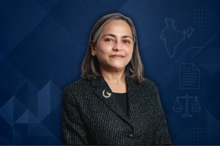 Dr. Shefaly Yogendra image with blue geometric background