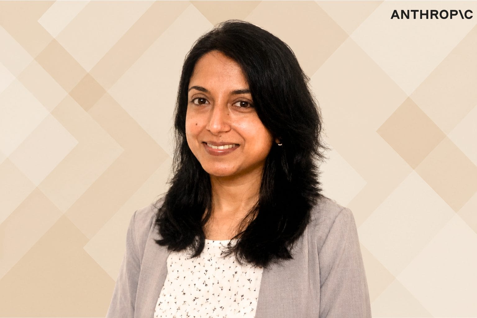 Sangeeta Bavi's portrait and anthropic logo with beige geometric background.