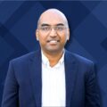 Dr. Arun Subramaniyan, founder, articul8, portrait with geometric deep blue background