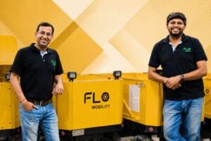 Flo Mobility founders and geometric background
