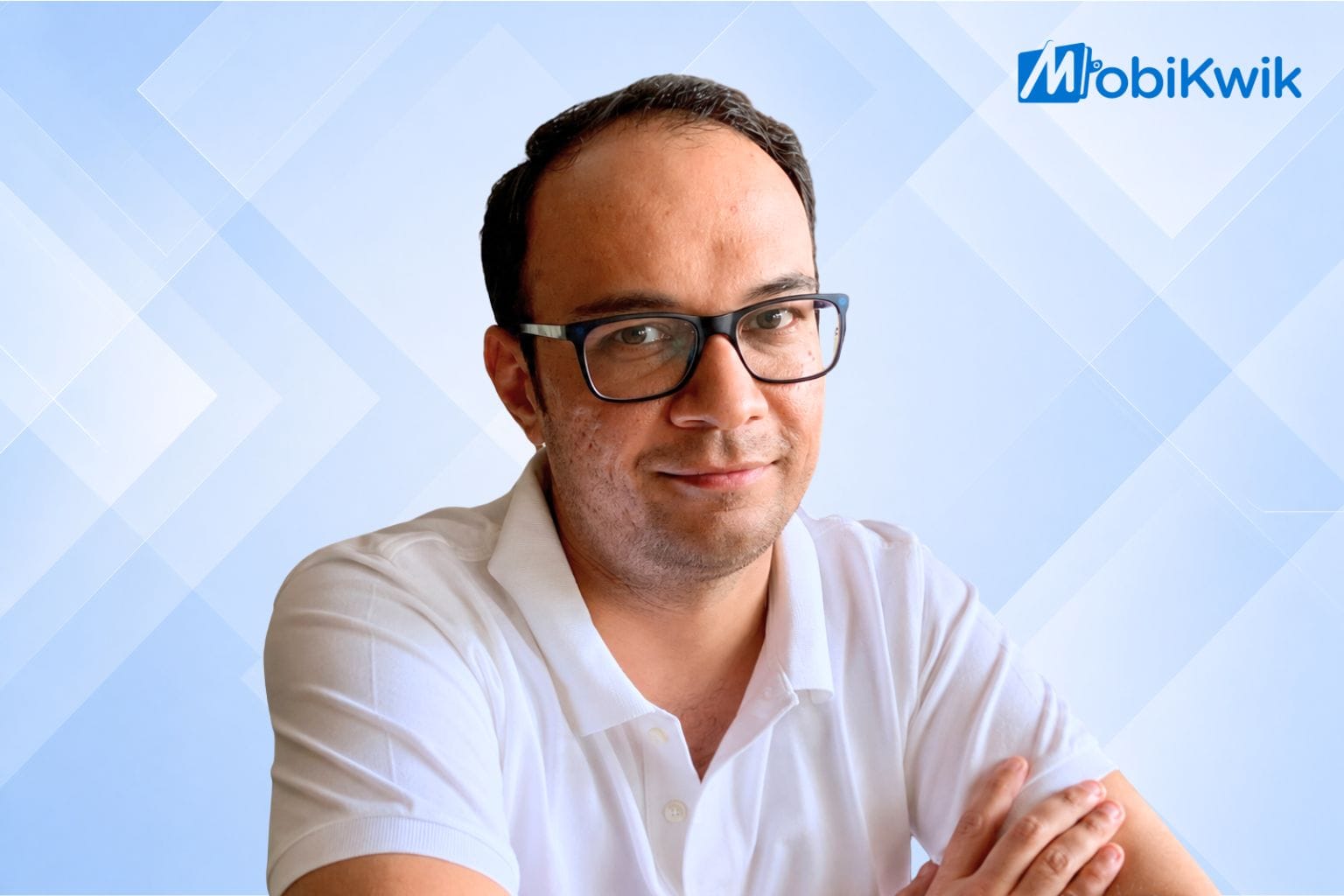 Mobikwik's head AI Ashish Dhar's portrait on a blue geometric background and mobikwik's logo