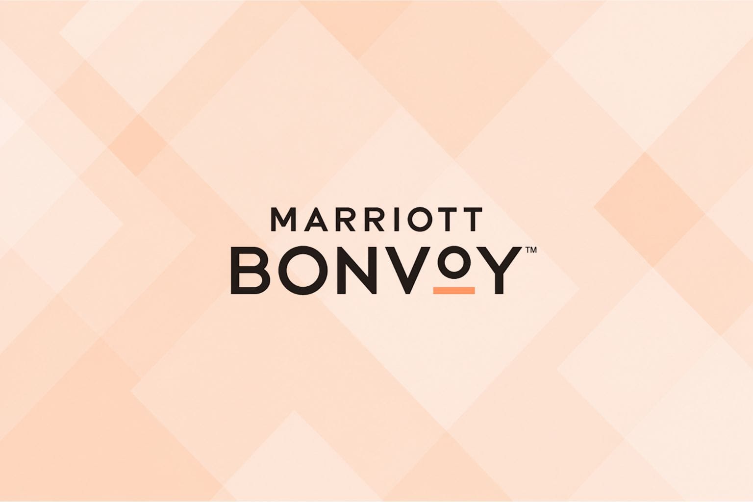 Marriott bonvoy logo on a peach geometric design