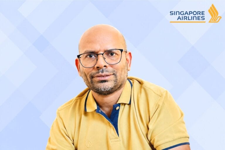 Arbind Lochan image and Singapore Airlines logo on a blue geometric background